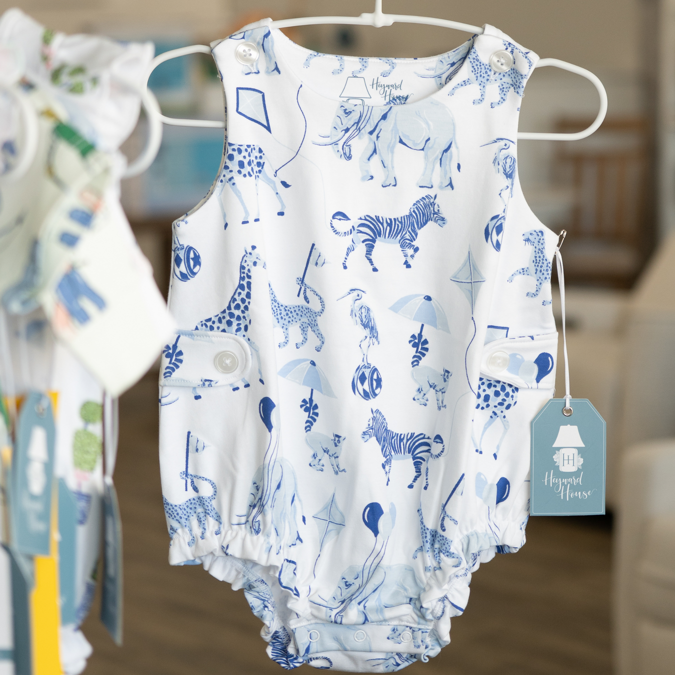 white baby sleeveless bubble outfit by heyward house with blue safari animals