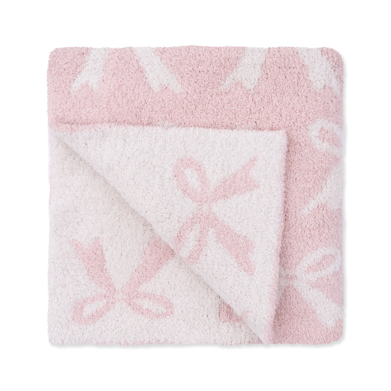 Pink and white fleece blanket with floral pattern on a white background