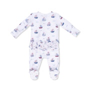 A baby long-sleeve footed sleeper in white, featuring an all-over sailboat print in blue and red, with a ruffled elastic waistband.