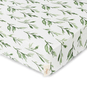 Fitted sheet with green leaf pattern on a white background