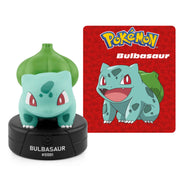 Pokémon Bulbasaur figurine with a Pokémon card in the background