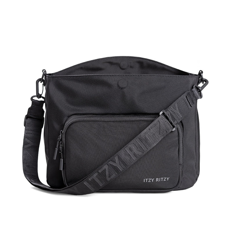 Itzy Ritzy transitional caddy and tote bag shown from the front with adjustable strap and exterior zip pocket