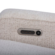 Textured cream fabric surface with a control panel featuring buttons and a power indicator.