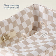Close-up of the padded interior and adjustable seat belt of the shopping cart cover