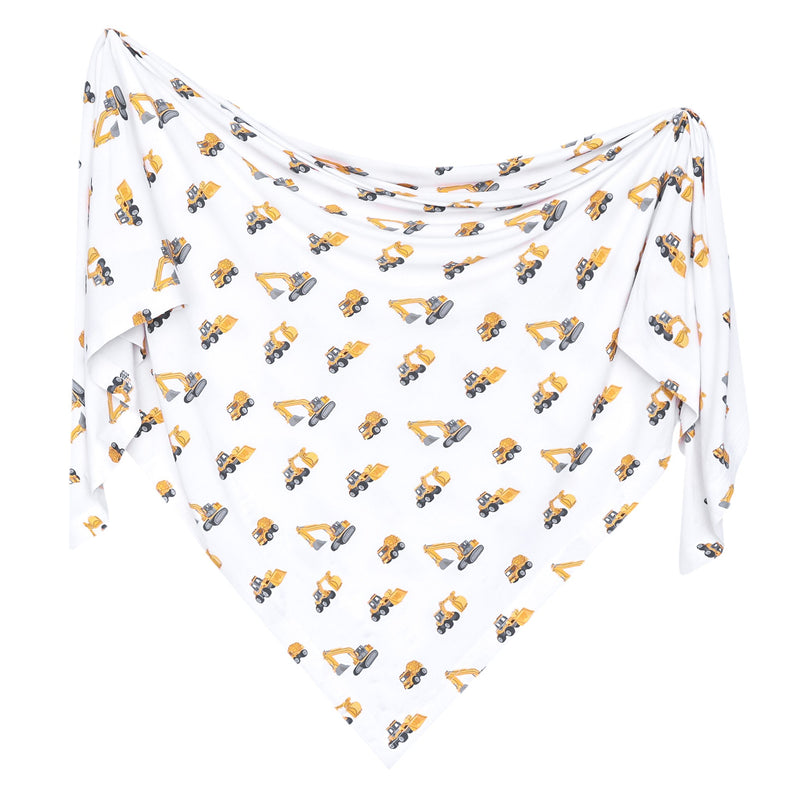 A white triangular baby swaddle blanket featuring an all-over print of yellow and gray construction excavators, displayed against a solid white background.