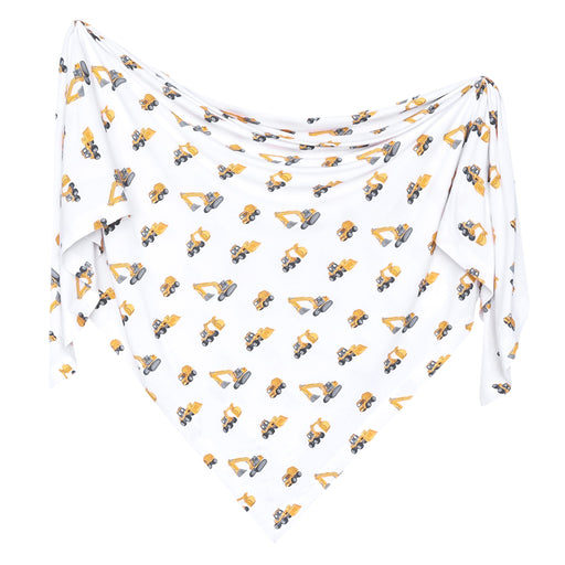 A white triangular baby swaddle blanket featuring an all-over print of yellow and gray construction excavators, displayed against a solid white background.