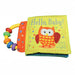 Cloth baby book titled Hello Baby Day and Night with an owl on the cover and a colorful rattle handle attached
