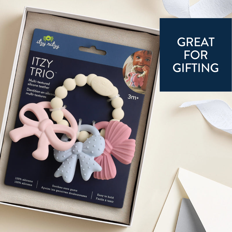 Itzy Trio teething ring shown in gift-ready packaging