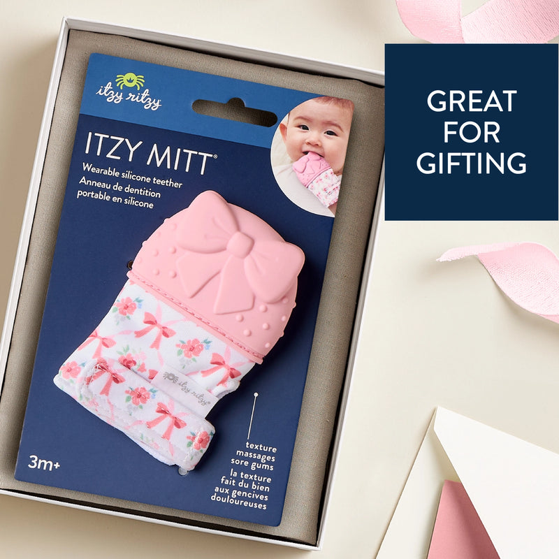 Itzy Ritzy silicone teether mitt shown in retail packaging labeled as great for gifting