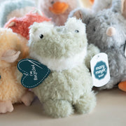 Plush toys with tags on a light surface