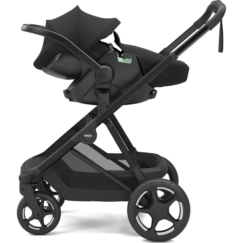 Thule Charm stroller in Black with Thule Maple infant car seat attached