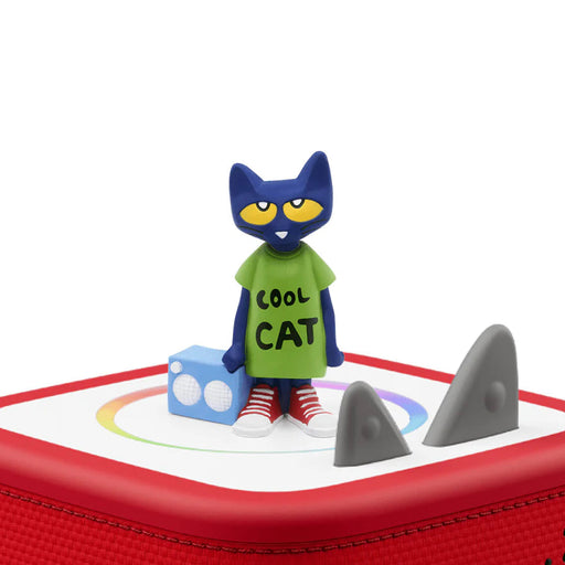 Toy figure of a cat in a green shirt with 'Cool Cat' text on a red tonies box.
