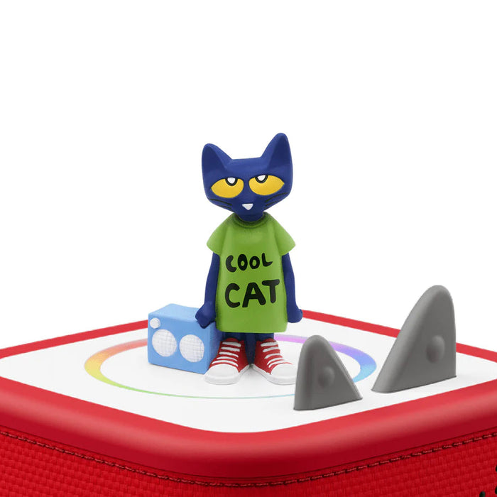 Toy figure of a cat in a green shirt with 'Cool Cat' text on a red tonies box.