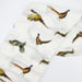 Flatlay of Saltwater Swaddles Pheasant and Quail bamboo cotton swaddle featuring hand-painted birds in flight on a white background