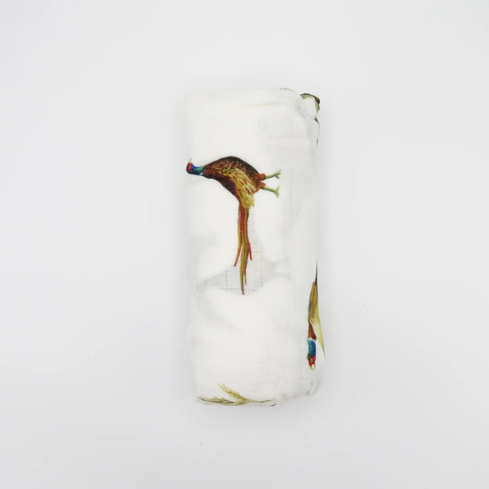 Rolled Saltwater Swaddles Pheasant and Quail swaddle blanket highlighting hand-painted bird pattern on white fabric