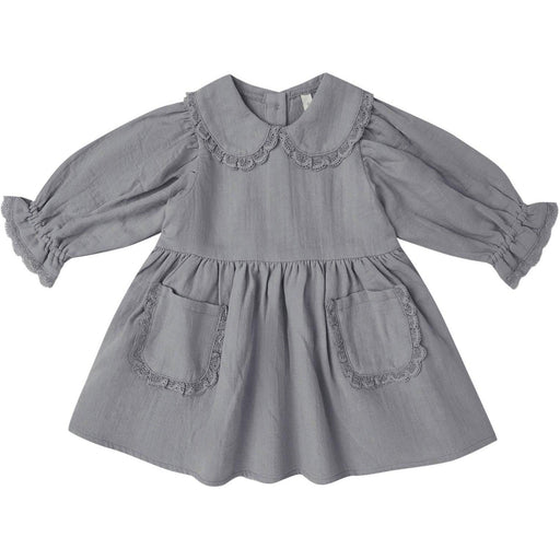 A gray long-sleeve baby dress with a ruffled Peter Pan collar, gathered sleeves, and two front patch pockets with matching ruffle trim, shown on a plain white background.