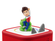 Ryder Tonie on a red Toniebox next to the gray ears, close-up