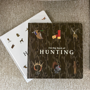 Book titled 'The Big Book of Hunting' on a textured surface