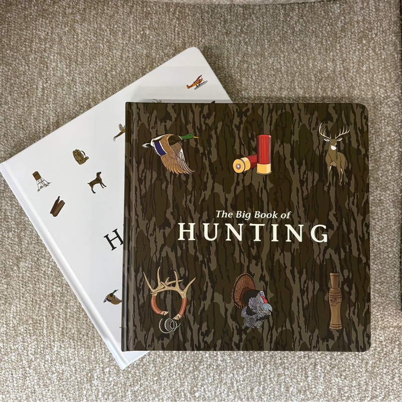 Book titled 'The Big Book of Hunting' on a textured surface
