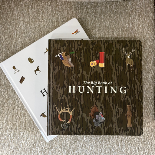 Book titled 'The Big Book of Hunting' on a textured surface