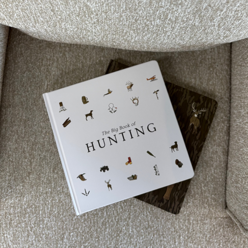 Baby board book titled 'The Big Book of Hunting' on a textured surface