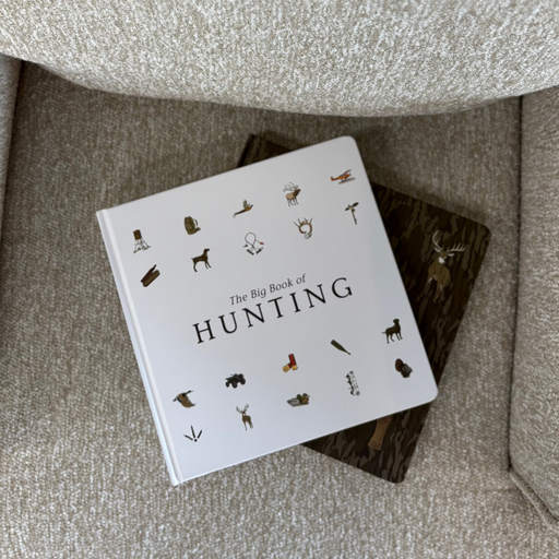 Baby board book titled 'The Big Book of Hunting' on a textured surface