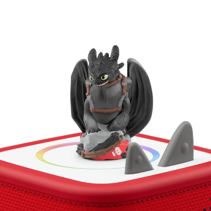 Toy dragon figure on a red and white base with a white background