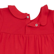 Close-up of a red dress with a collar on a white background