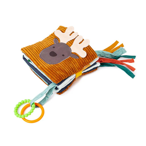 A plush, ribbed brown soft baby book with a cute moose face on the cover, colorful fabric tags on the side, and two attached teething rings (one green beaded, one orange smooth).