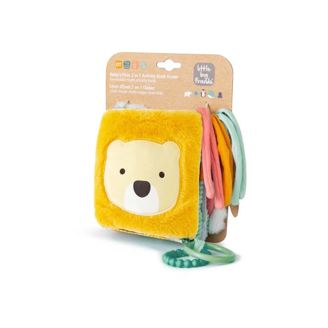 Packaged soft activity book with yellow bear cover and teething rings attached.