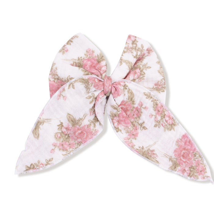 Large bow with tails hair clip in heirloom bouquets floral, laid flat