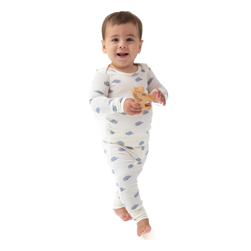 Toddler wearing cowboy hats loungewear set, standing and smiling