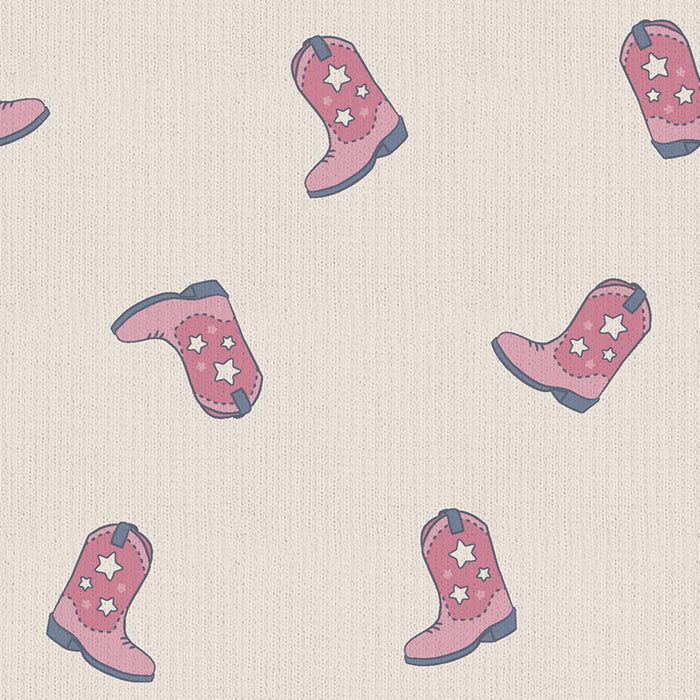 Close-up swatch of pink cowgirl boots print on ribbed knit