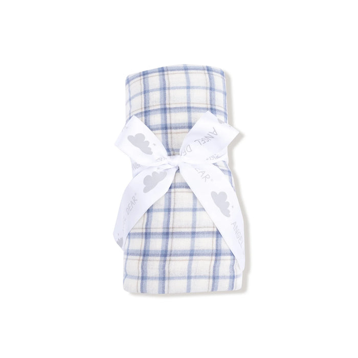 Blue plaid muslin swaddle rolled and tied with white ribbon