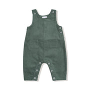 Flat lay of dark ivy corduroy baby overalls with adjustable straps, side buttons, snap inseam, and two front pockets