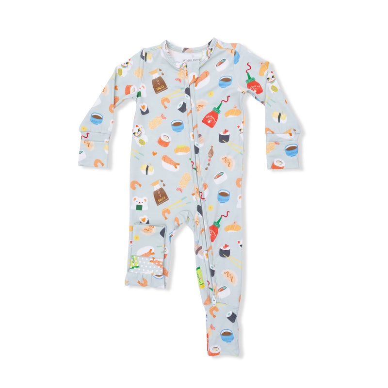 Children's onesie with colorful food pattern on a light blue background
