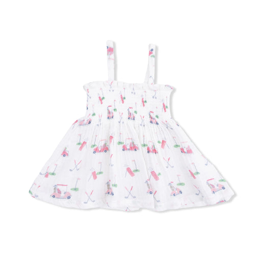 A white sleeveless baby dress with thin shoulder straps, featuring an allover print of pink and blue golf carts and golf clubs on a clean white background.