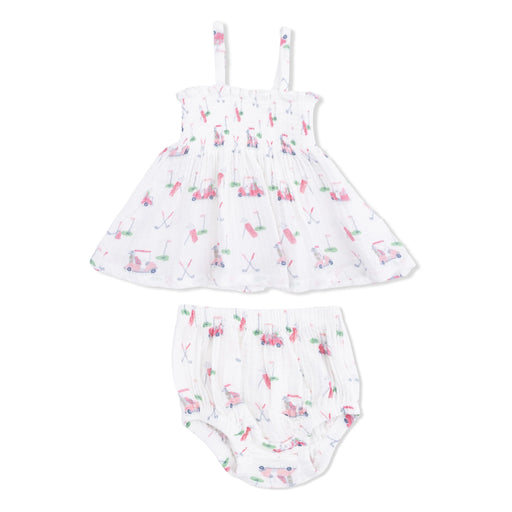 A baby girl's two-piece outfit set consisting of a white smocked dress with thin shoulder straps and matching white smocked bloomers, both decorated with a colorful pink, green, and blue golf-themed print, shown against a plain white background.