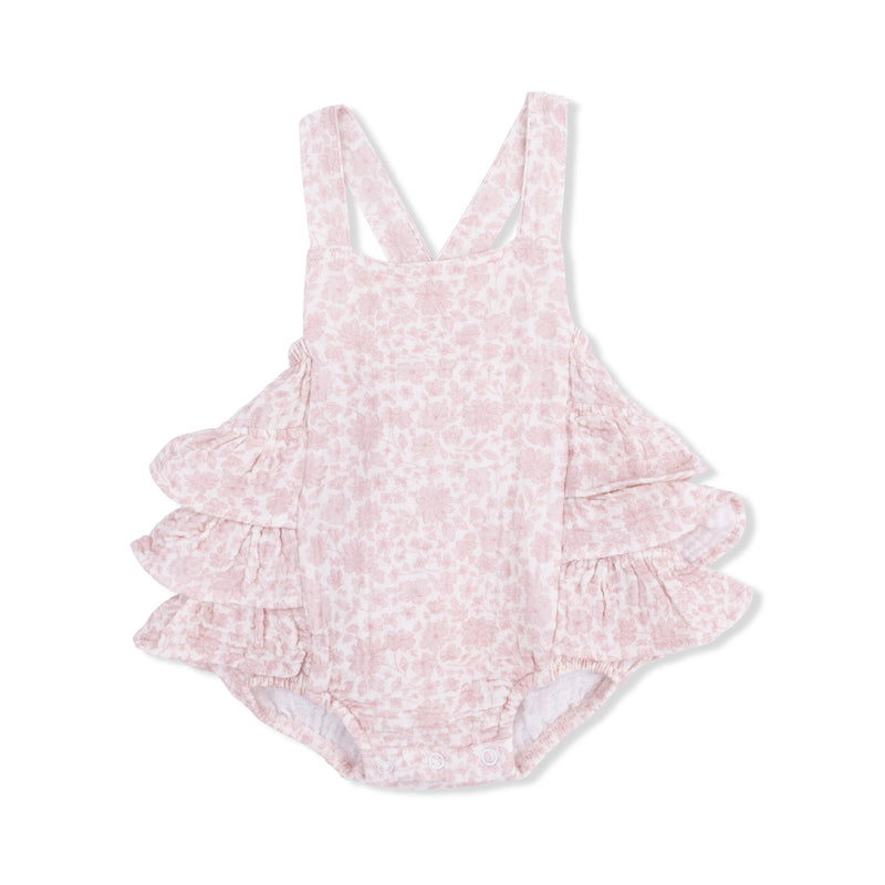Pink floral ruffled sunsuit on a white background