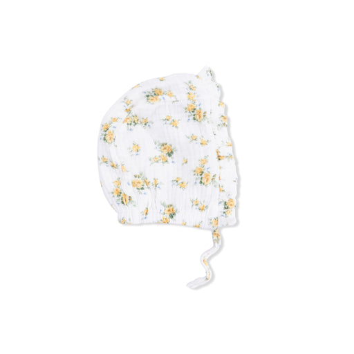 Baby bonnet with yellow floral pattern on a white background