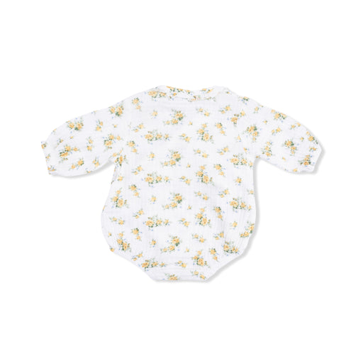 White baby onesie with yellow floral pattern on a white background