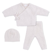 Baby outfit set with cardigan, pants, and hat on a white background