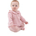 Baby wearing a pink checkered outfit on a white background