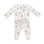 A baby footed one-piece sleeper with long sleeves and a ruffled waist, featuring a whimsical print of fairies, Christmas trees, and snowflakes on a white background.