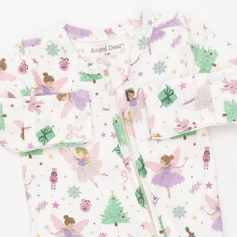 A long-sleeve baby sleep sack by Angel Dear featuring a whimsical fairy and Christmas tree print on a white background.