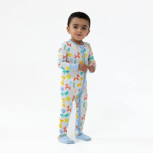 Toddler standing and wearing the Blue Balloon Animals romper against a white backdrop.