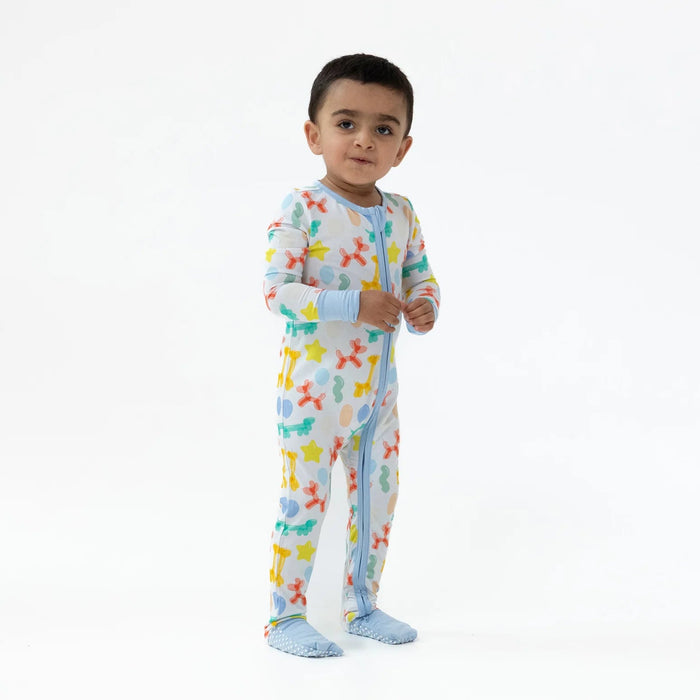 Toddler standing and wearing the Blue Balloon Animals romper against a white backdrop.