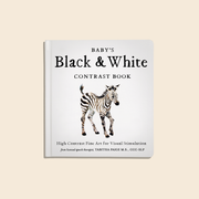 Book titled 'Baby's Black & White Contrast Book' with a zebra illustration on a beige background