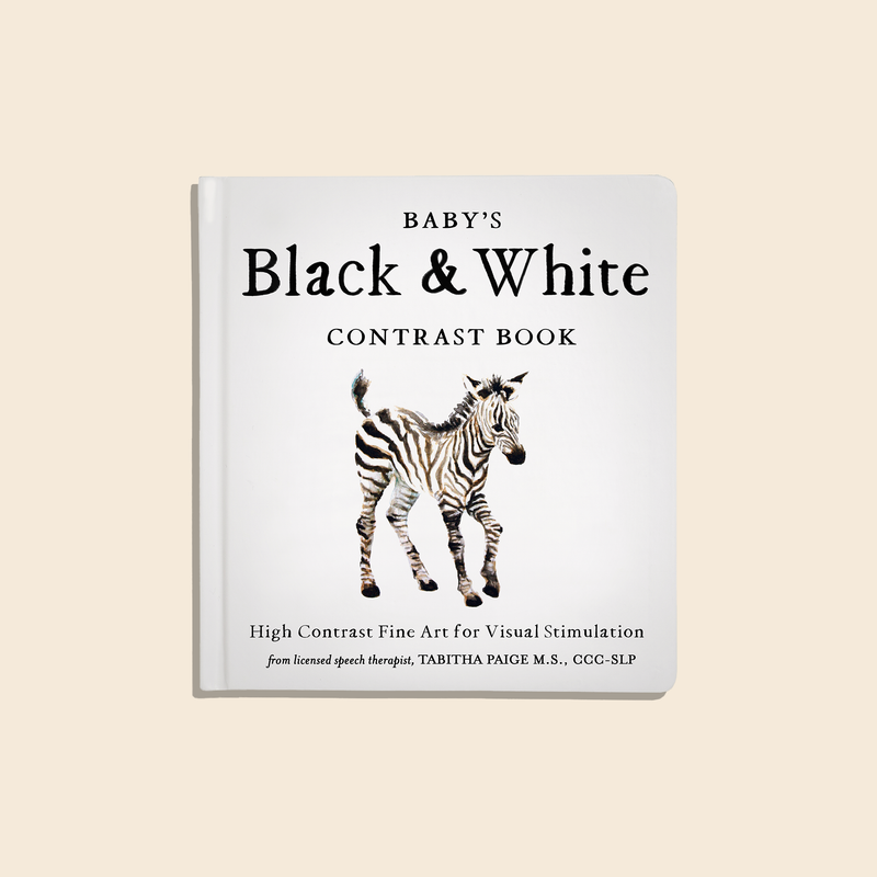 Book titled 'Baby's Black & White Contrast Book' with a zebra illustration on a beige background