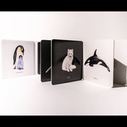 Set of animal-themed notebooks with penguin, polar bear, and orca design on a white background
